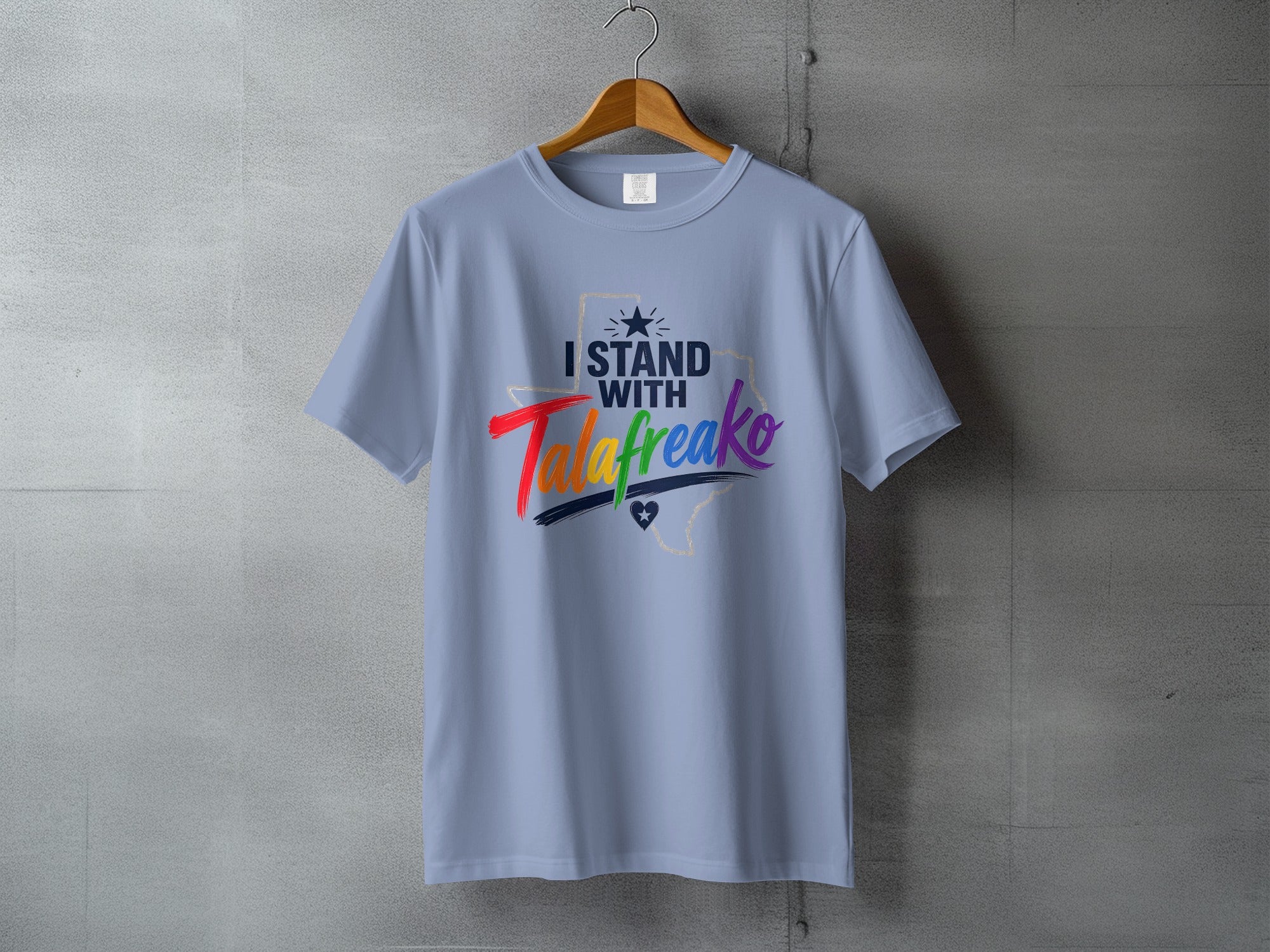 Light blue t-shirt with "I STAND WITH" and Texas graphic.