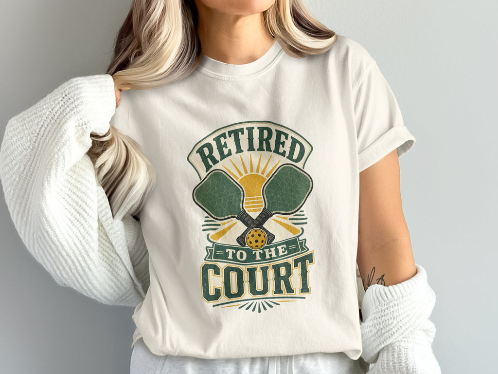 Pickleball t-shirt with "Retired to the Court" text and crossed paddles.