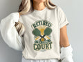 Pickleball t-shirt with "Retired to the Court" text and crossed paddles.