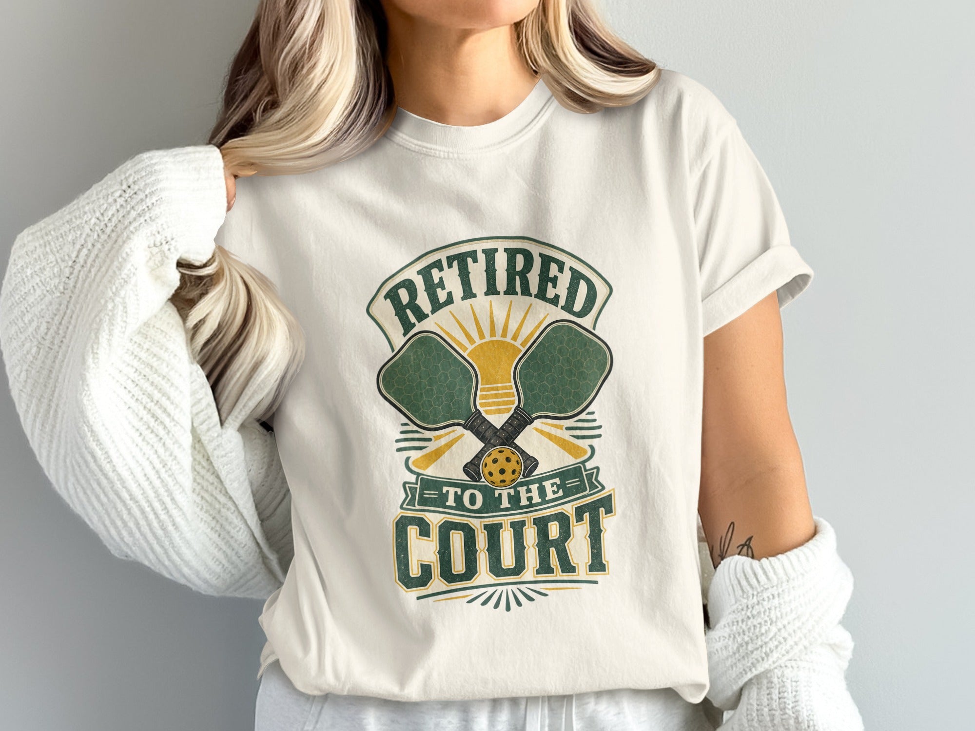 Pickleball t-shirt with "Retired to the Court" text and crossed paddles.