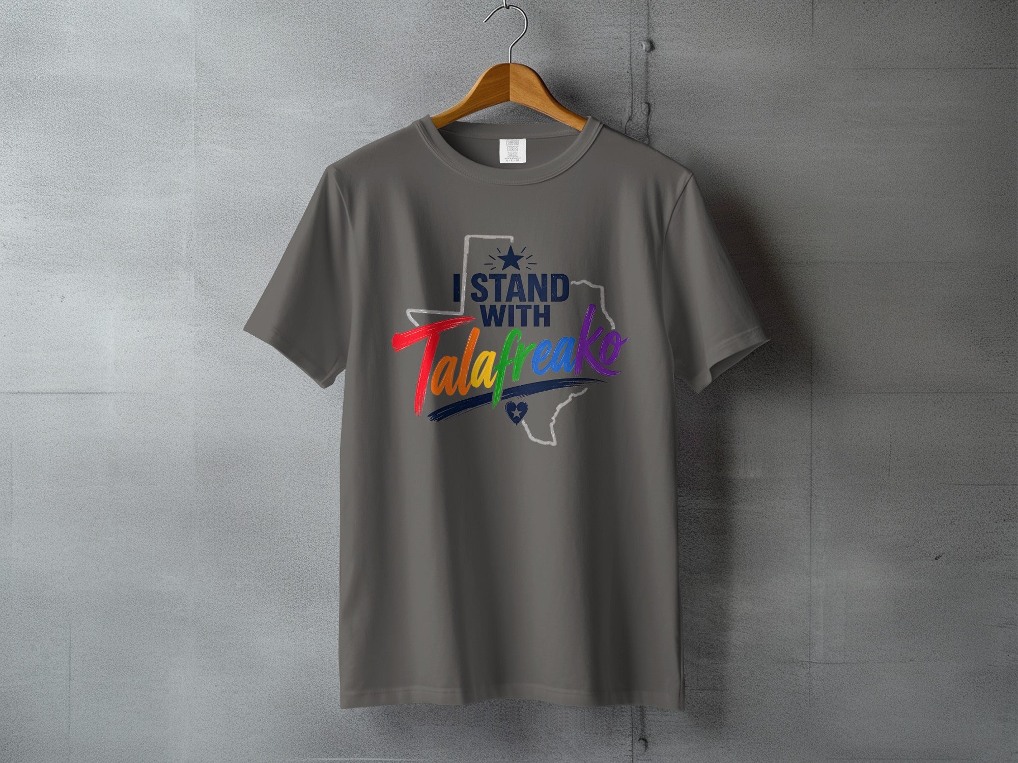 Gray t-shirt with "I stand with Texas" and rainbow heart graphic.
