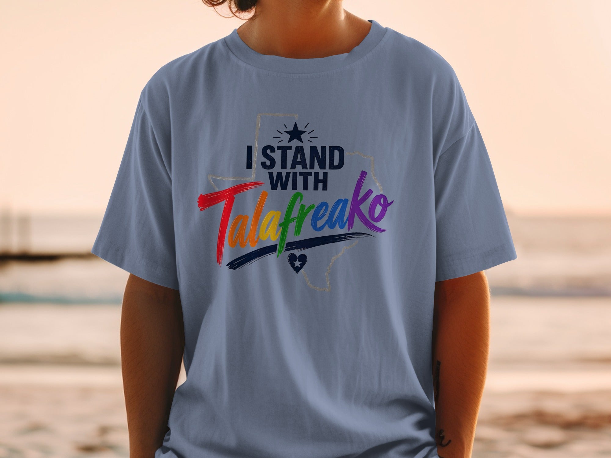 T-shirt with "I Stand With Talafreako" and rainbow colors over Texas outline.