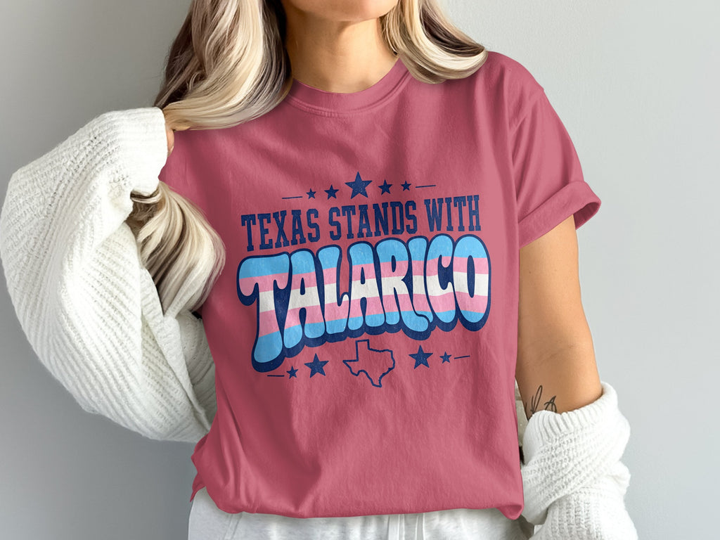 T-shirt with "Texas Stands With Talarico" text in trans flag colors.