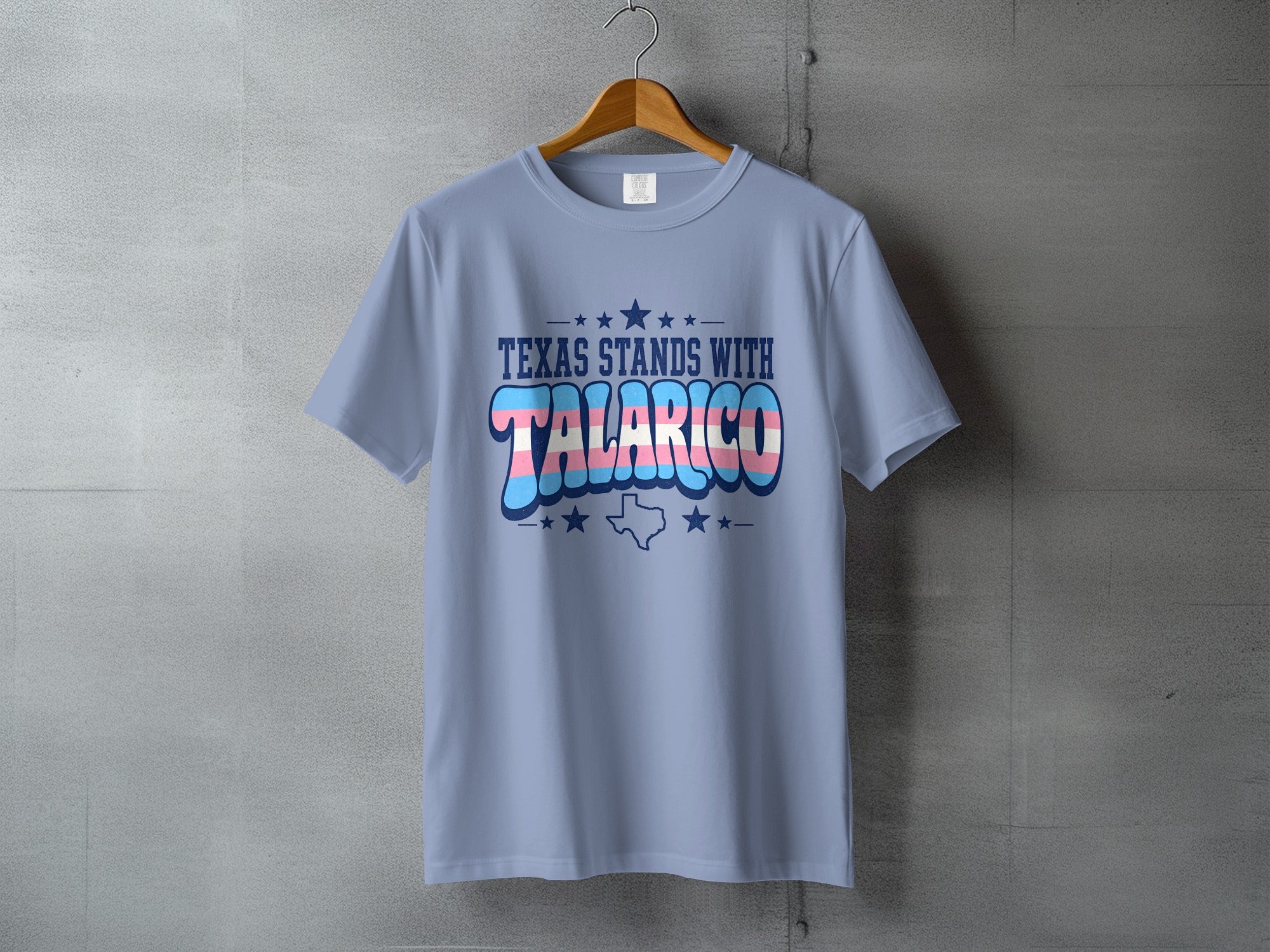 Light blue t-shirt with "TEXAS STANDS WITH TALARICO" and trans flag colors.