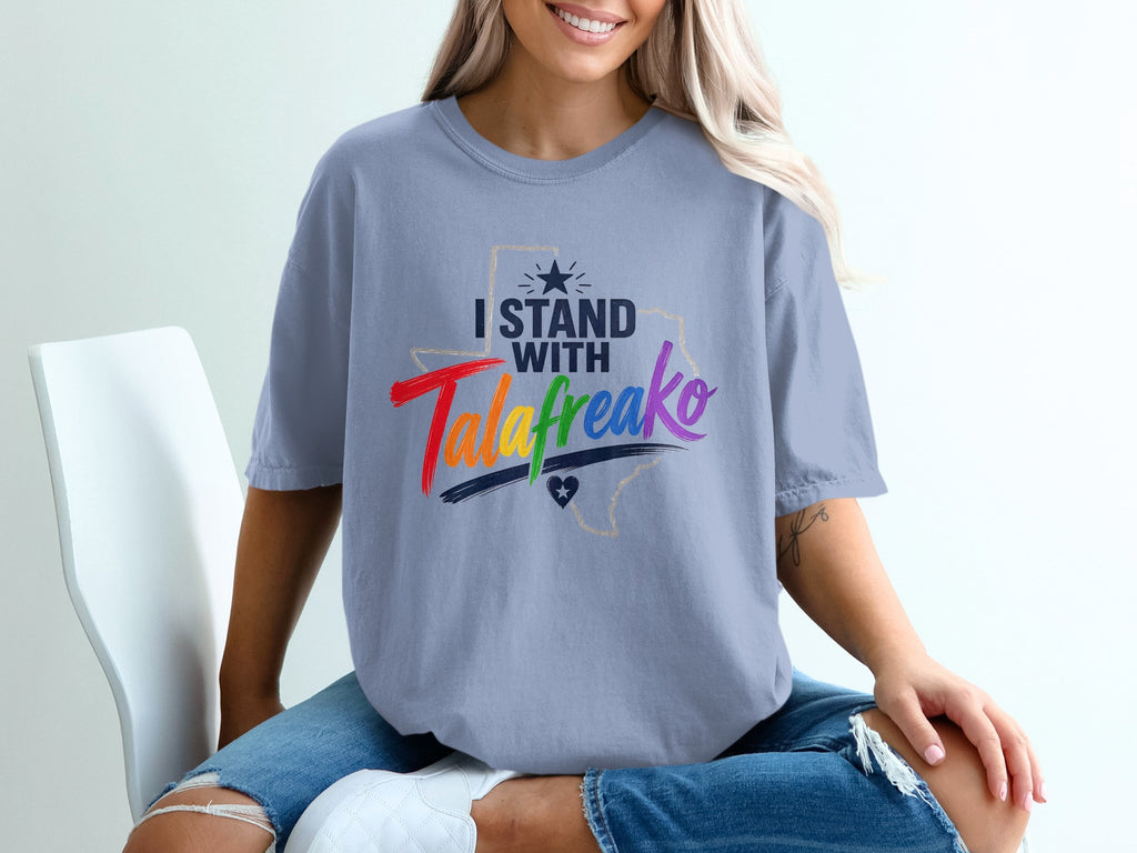 Light blue t-shirt with "I Stand With" and "TalaFreako" text, Texas outline.