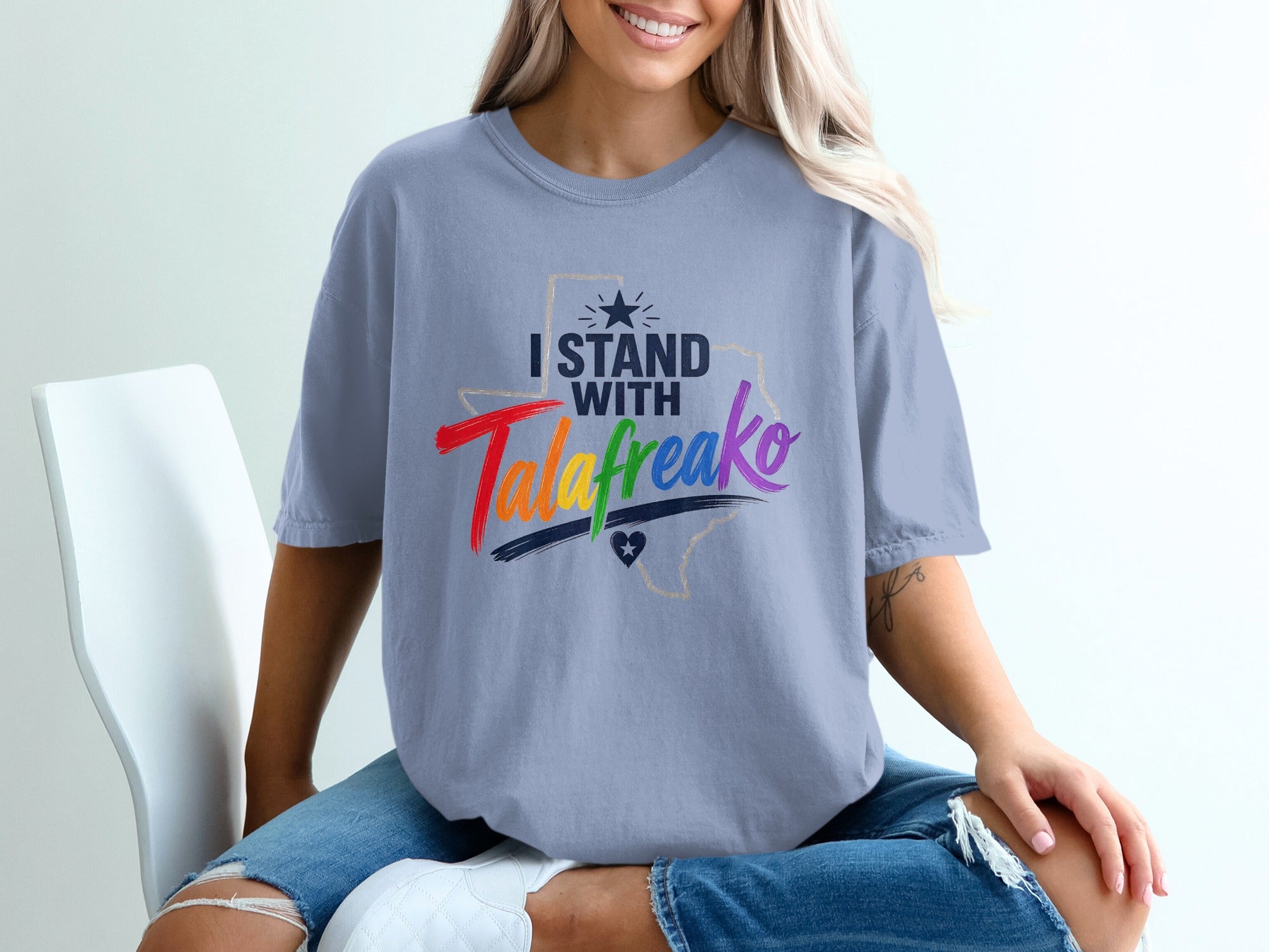 Light blue t-shirt with "I Stand With" and "TalaFreako" text, Texas outline.