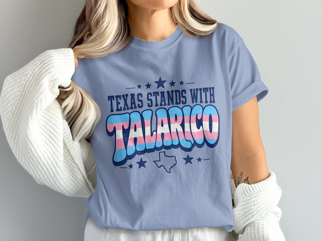 T-shirt with "Texas Stands With" and transgender flag colors.